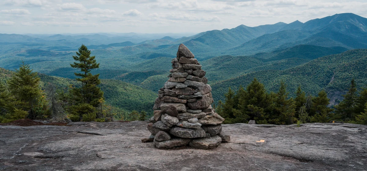 Summit cairn overlooking the High Peaks in Keene, New York