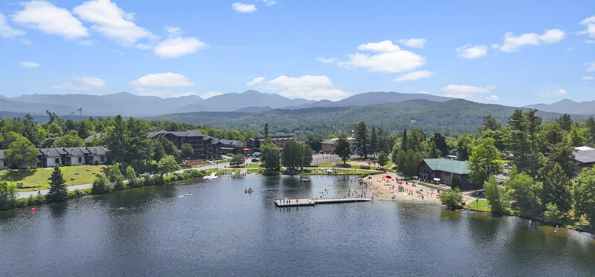 Mirror Lake public beach and waterfront in summer in Lake Placid, New York