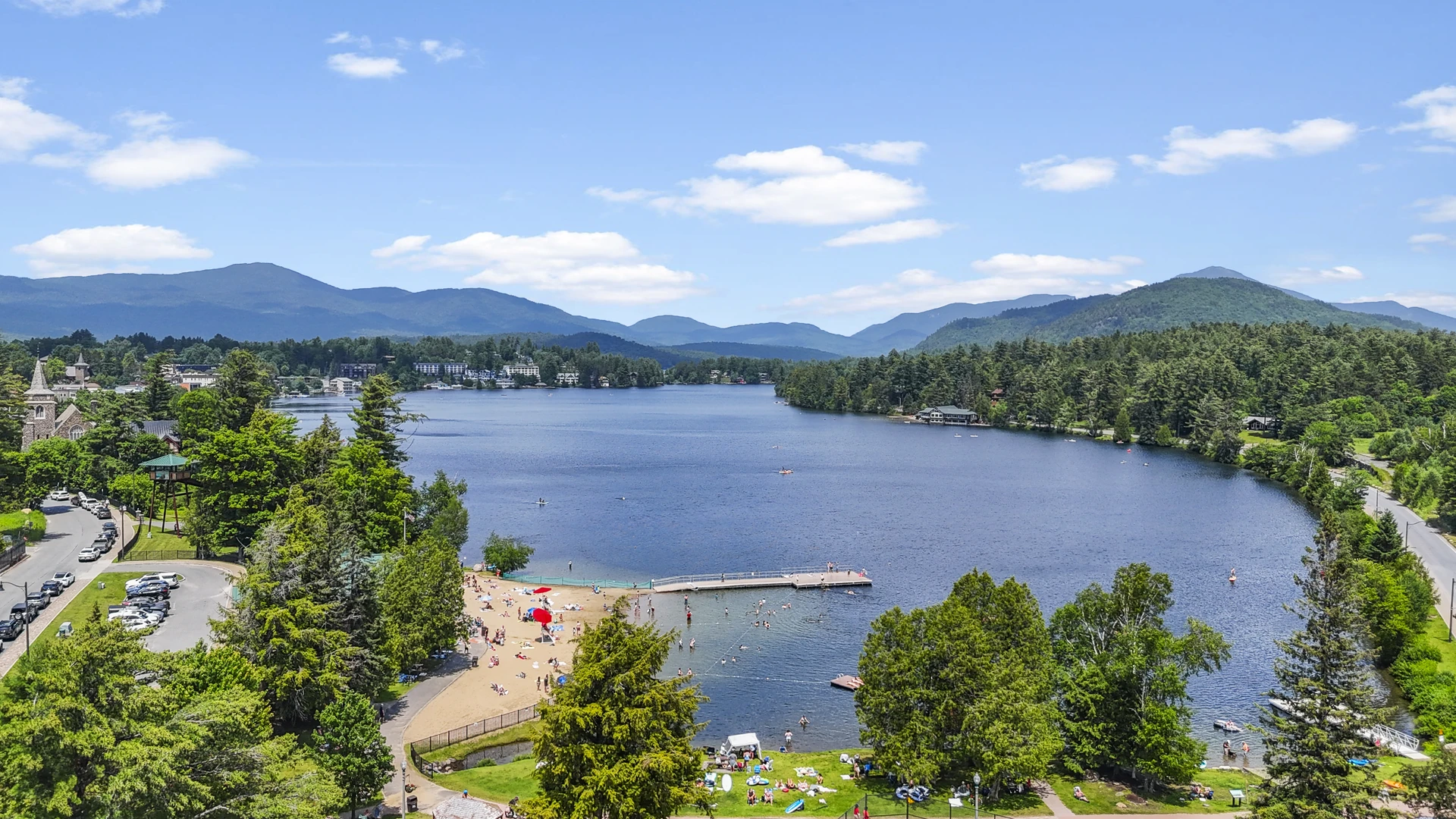 Mirror Lake and the village waterfront in Lake Placid, New York with Adirondack High Peaks beyond