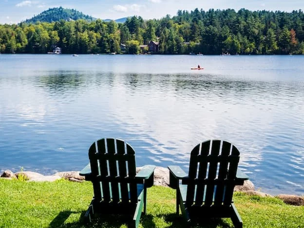 Adirondack chairs overlooking a lake in the Adirondacks, New York