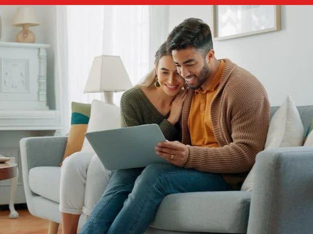 Couple reviewing home value information online